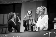 Street life, The Girls, enjoying a glass of wine or a drink on the balcony of bar overlooking Queen St, Auckland City