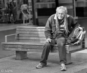 homeless old man with dreads in Queen Street