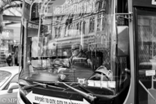 bus driver, Queen St, Auckland, patience, black and white