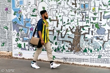 Stepping out in Queen St, Auckland, wall mural