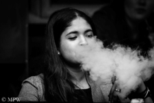 Smoking woman, off Queen Street, Auckland